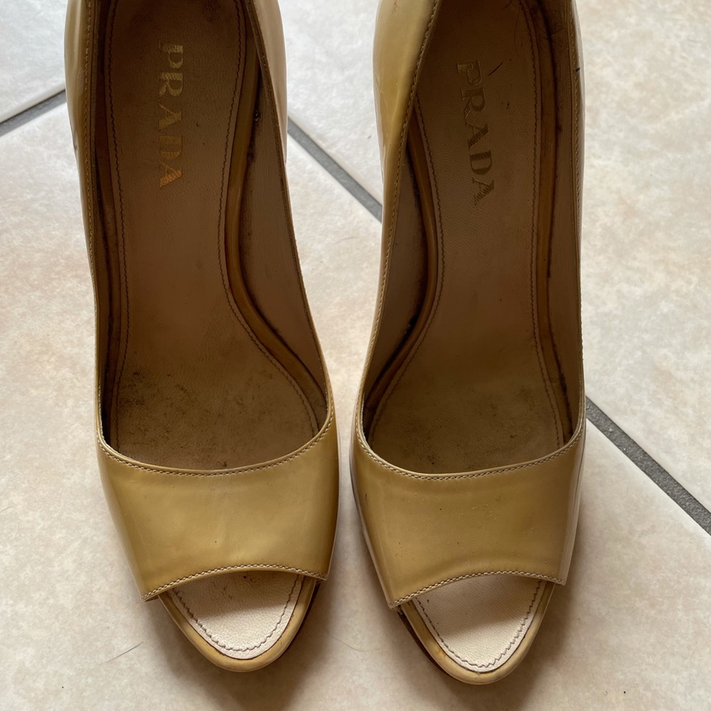 Cream patent leather Prada heels light scuffing